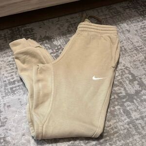 Tan colored size small Nike joggersrs